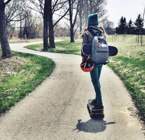 Riding A Skateboard With Backpack on